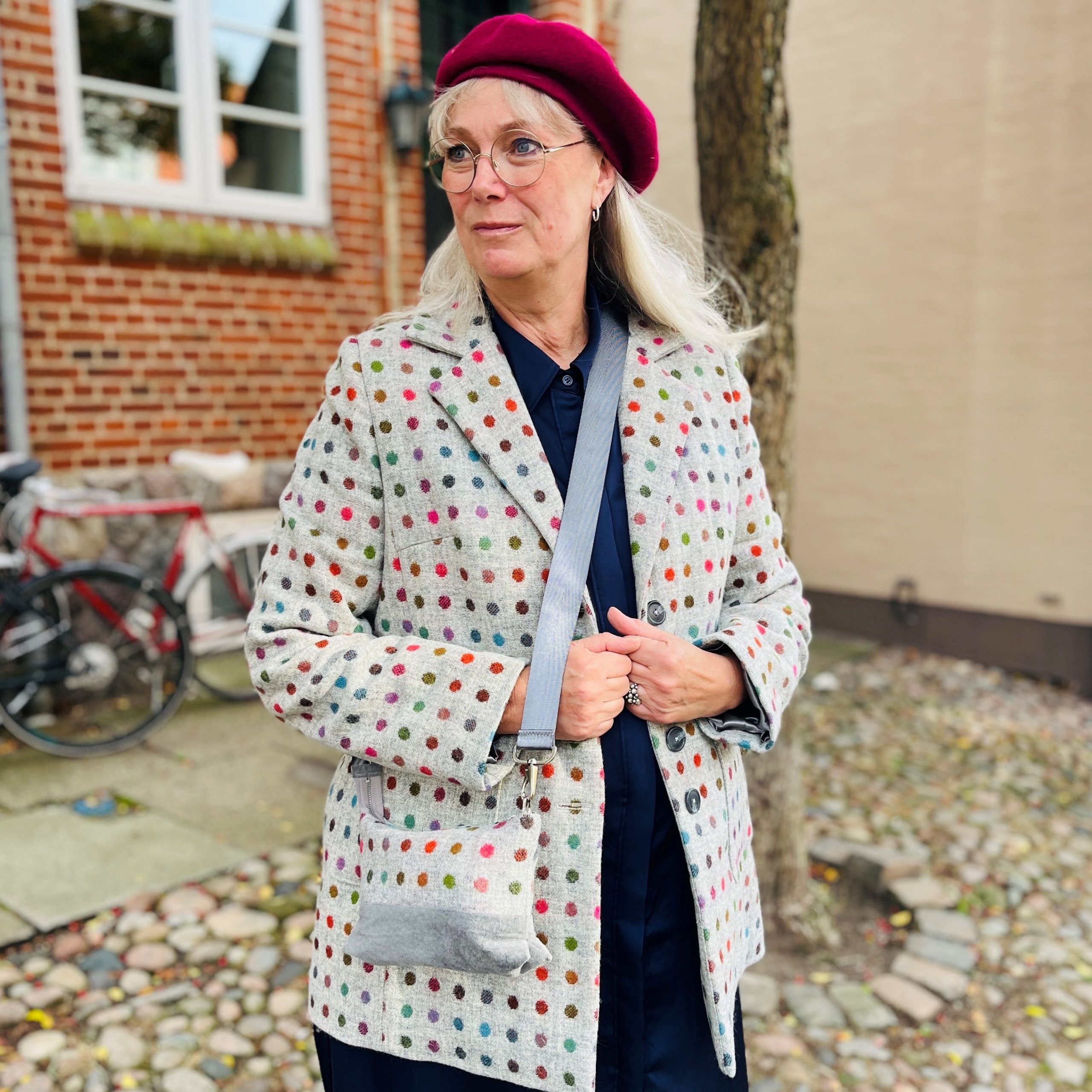 grey polka dotted tweed blazer with pockets and bag