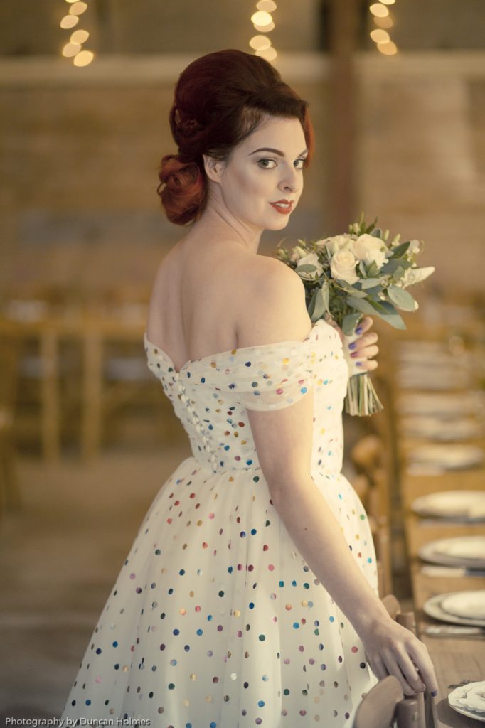 bride in off the shoulder polka dot wedding dress