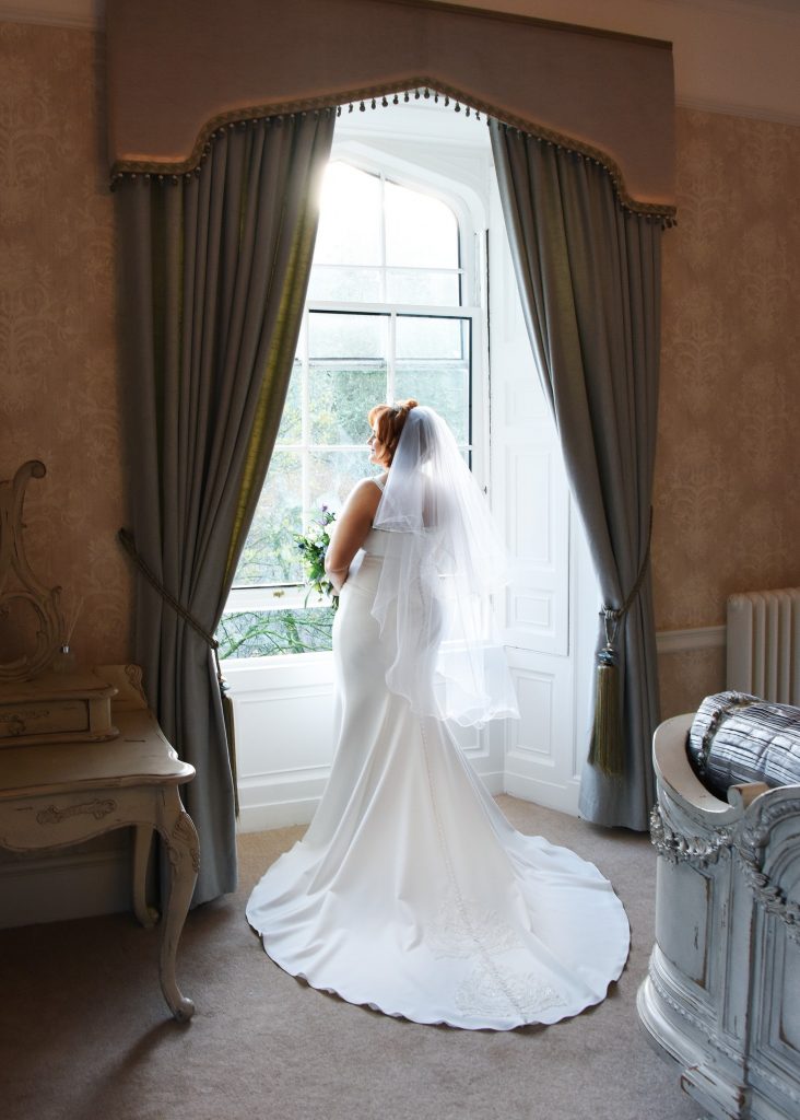 bridal portrait back view castle winter wedding