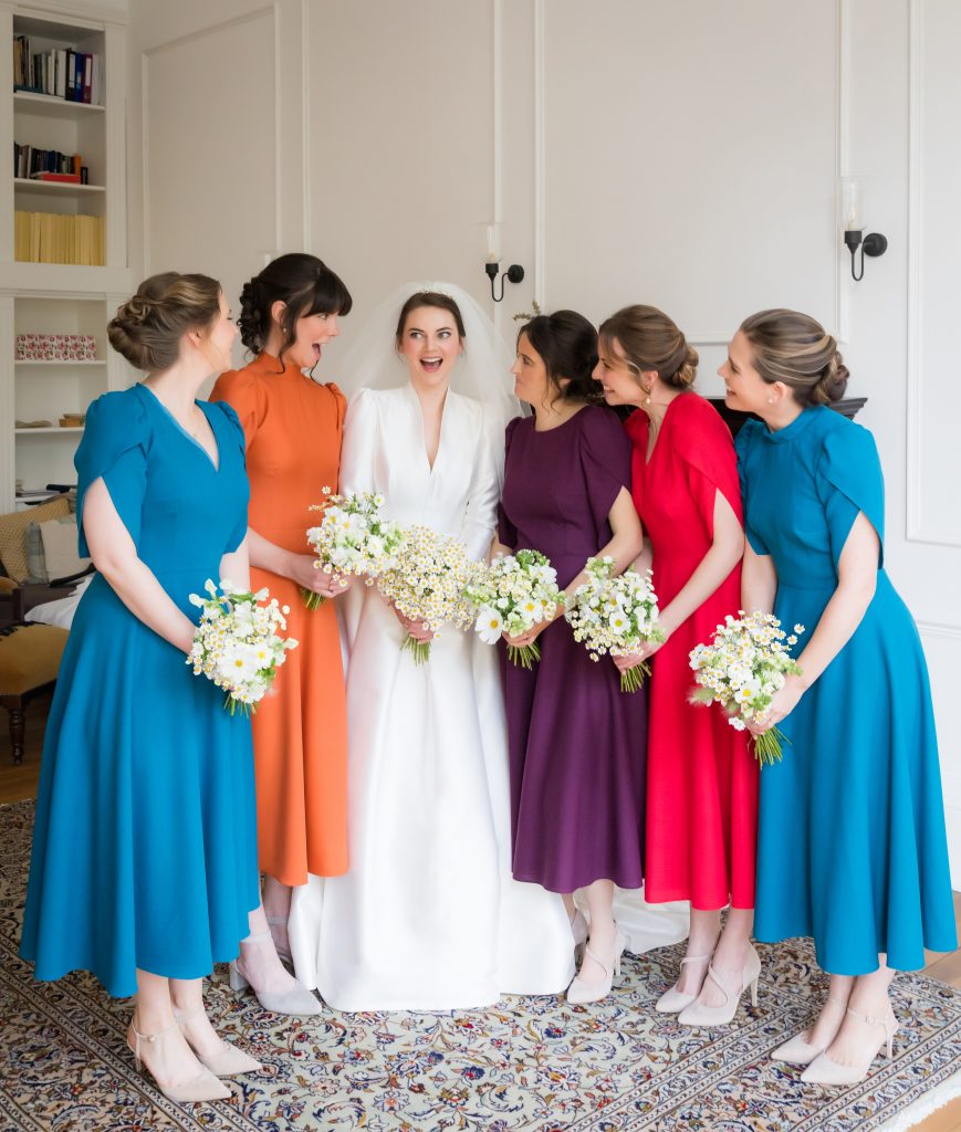 the bride with her bridesmaid in the wool crepe dresses