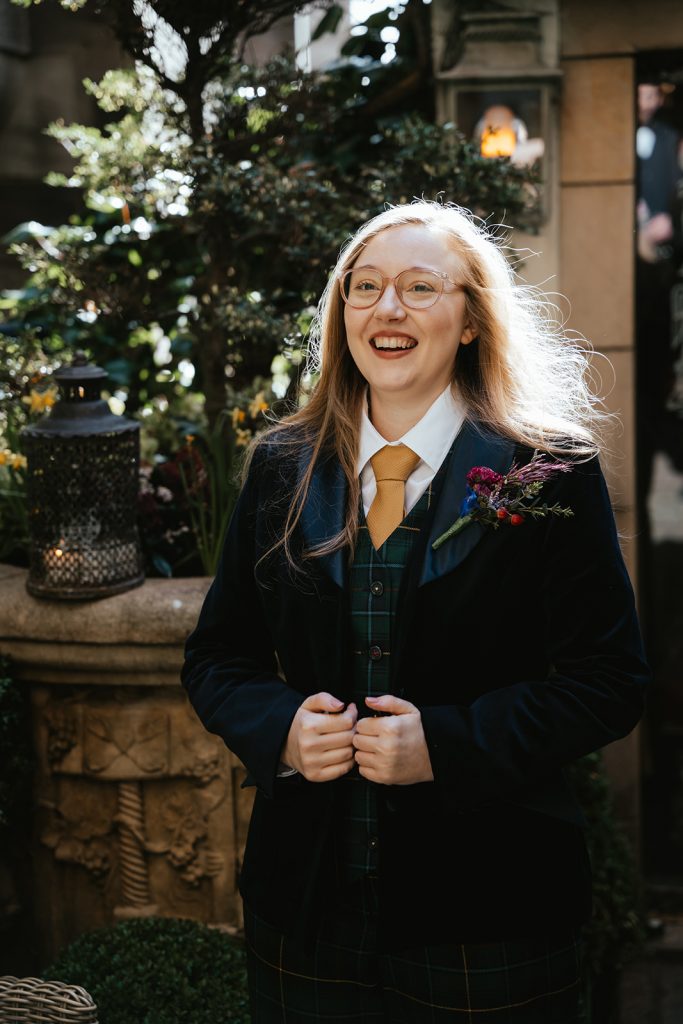 bride in tartan suit