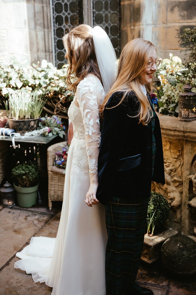 two brides in dress and suit