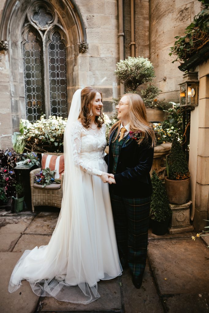 two brides in dress and suit