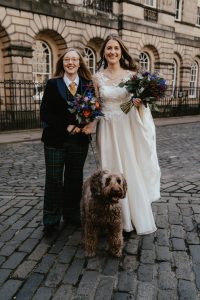 2 brides - one in bespoke suit, one in bespoke wedding dress