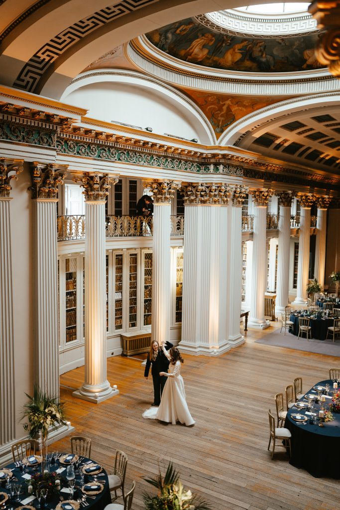 two brides in dress and suit