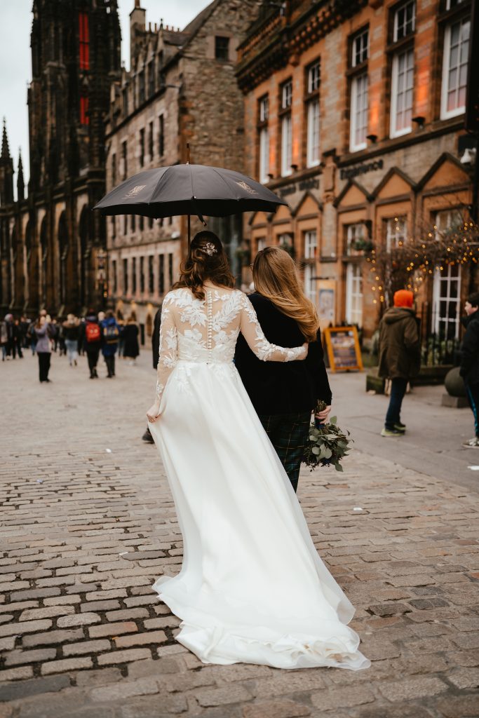 two brides in dress and suit