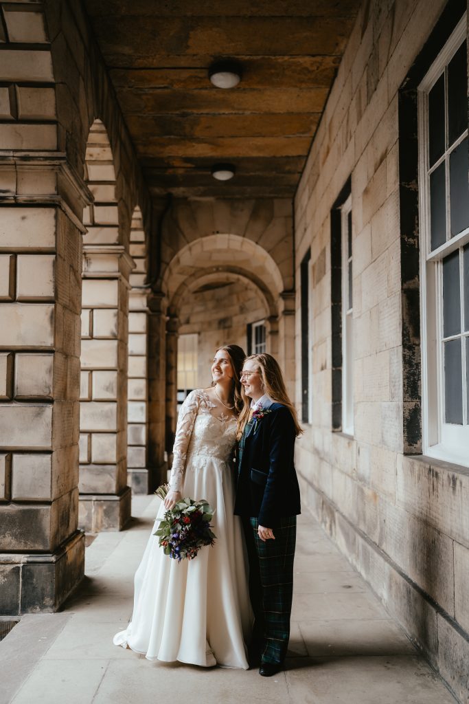 two brides in dress and suit