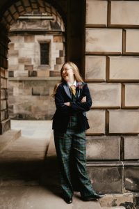 bride in tartan wedding suit and velvet jacket