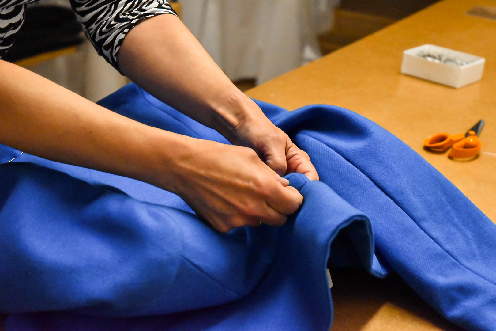 hands doing dressmaking and ladies tailoring