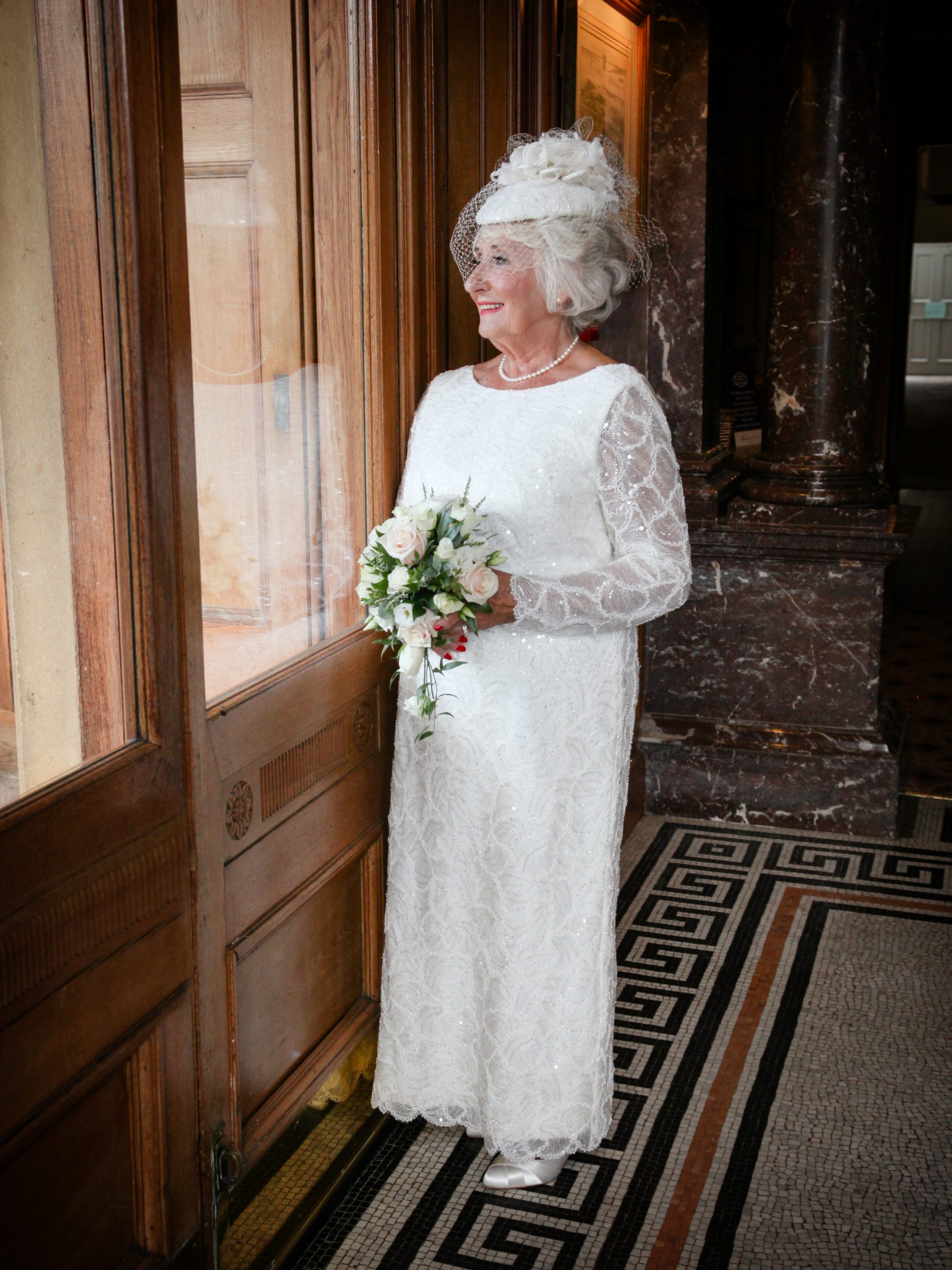 older bride in lace wedding dress