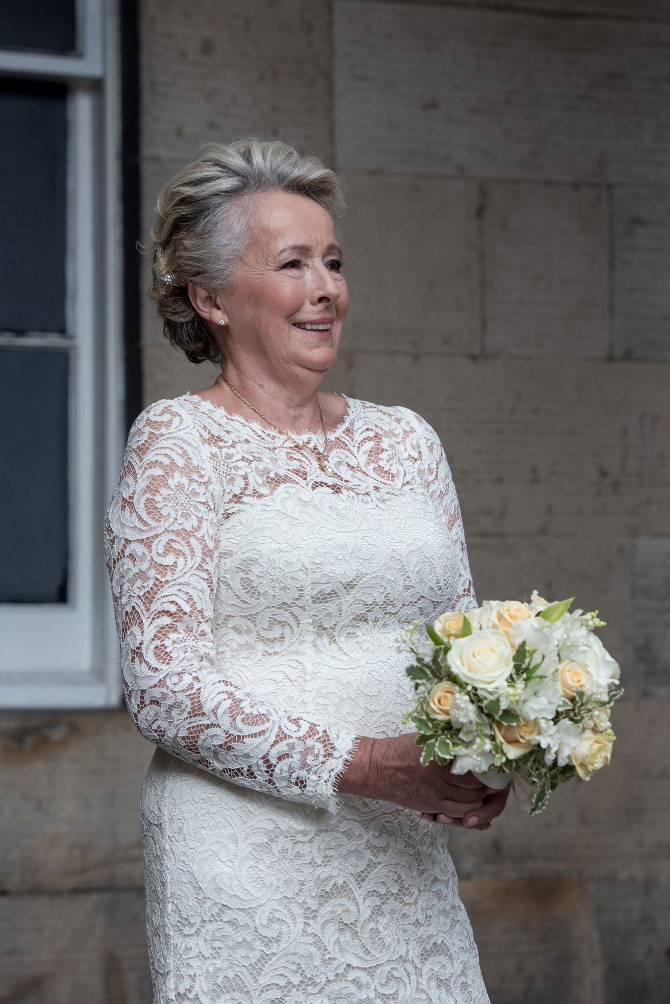 mature bride in silk backed lace wedding dress